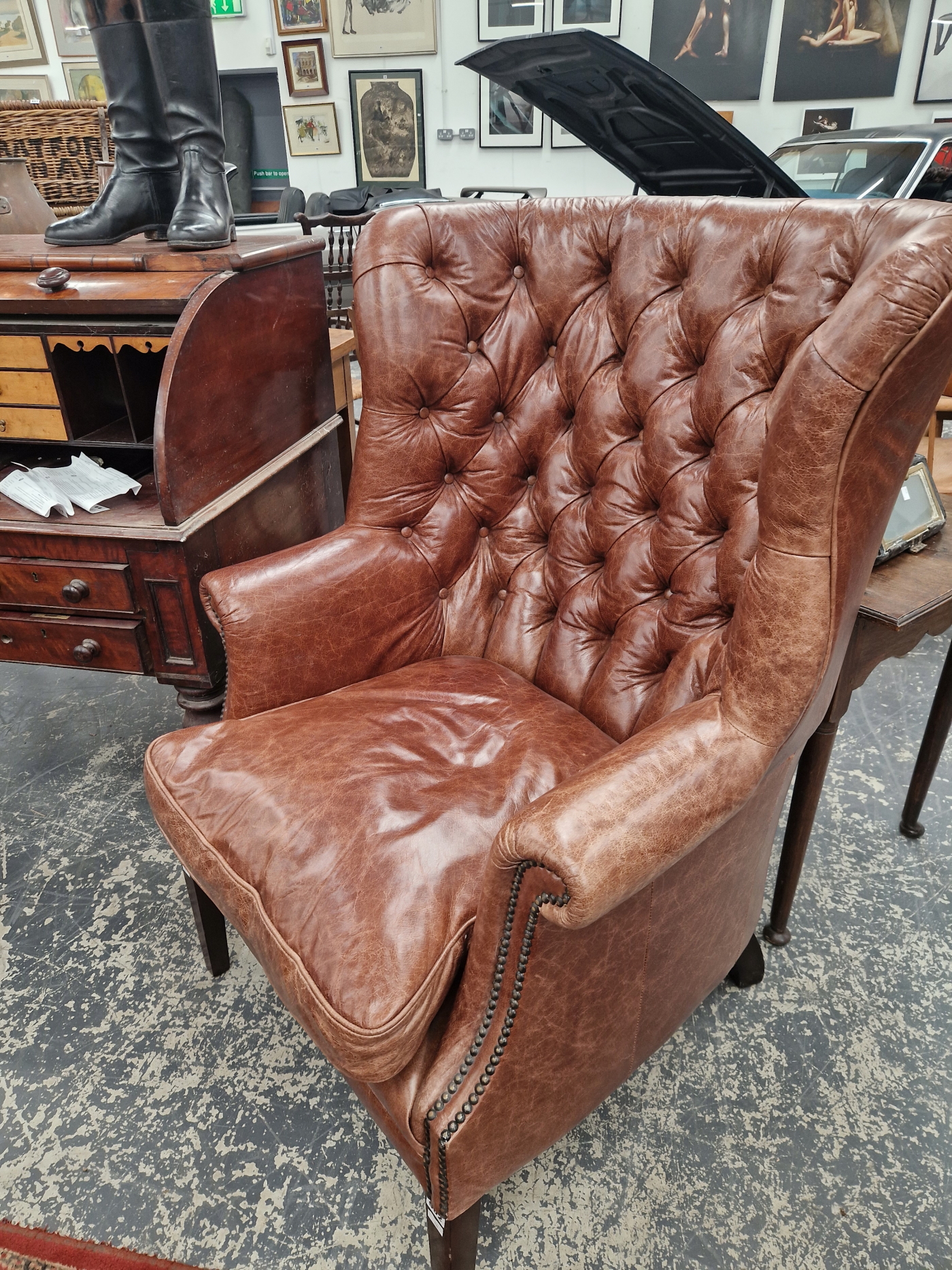 A MAHOGANY WING ARMCHAIR BUTTON UPHOLSTERED IN BROWN LEATHERETTE, CLOSE NAILING RUNNING FROM THE - Image 2 of 5