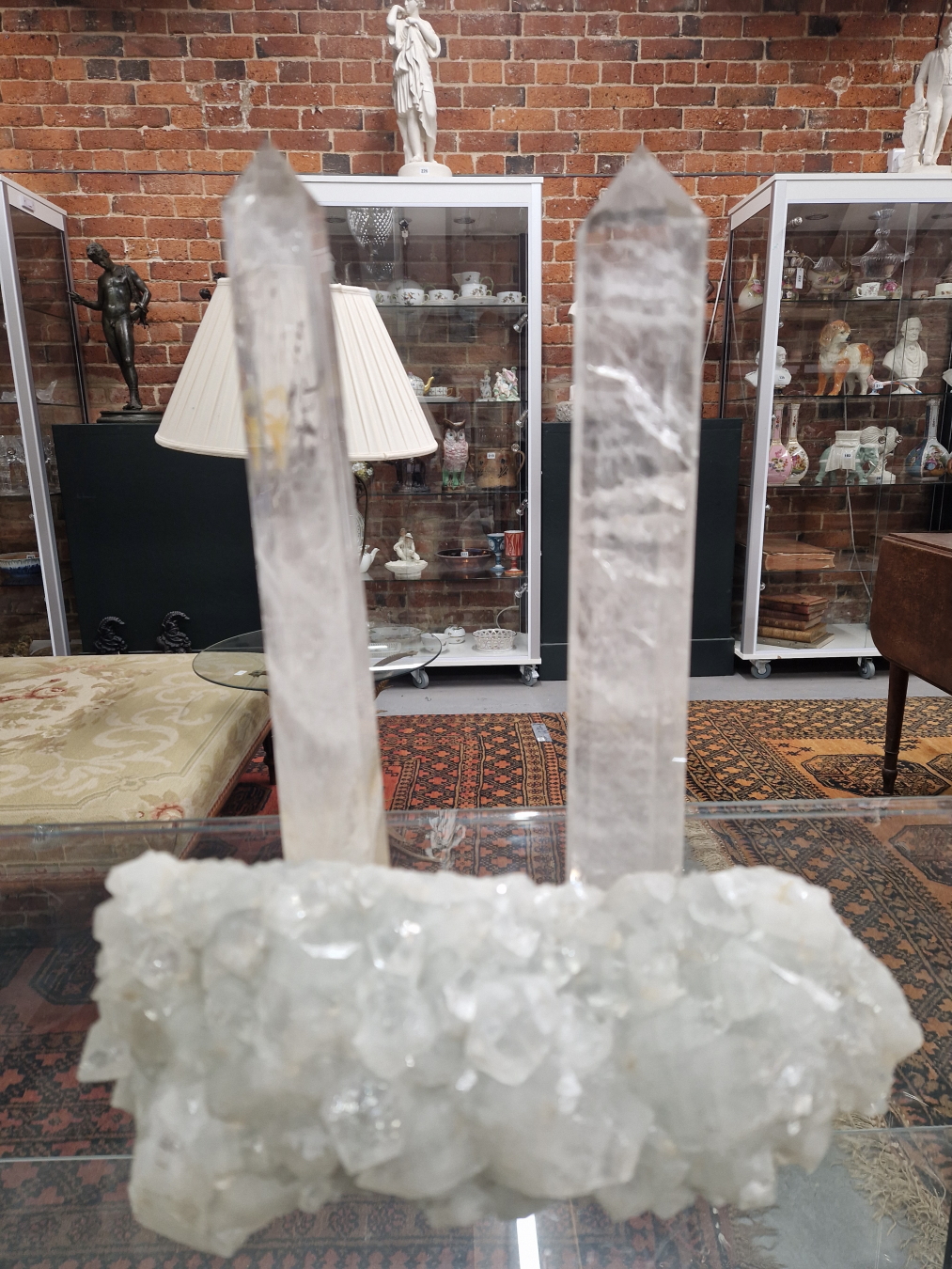 A PAIR OF CUT ROCK CRYSTAL OBELISK TOGETHER WITH A NATURAL CRYSTAL FORMATION