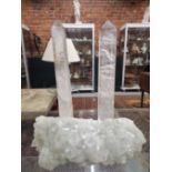 A PAIR OF CUT ROCK CRYSTAL OBELISK TOGETHER WITH A NATURAL CRYSTAL FORMATION