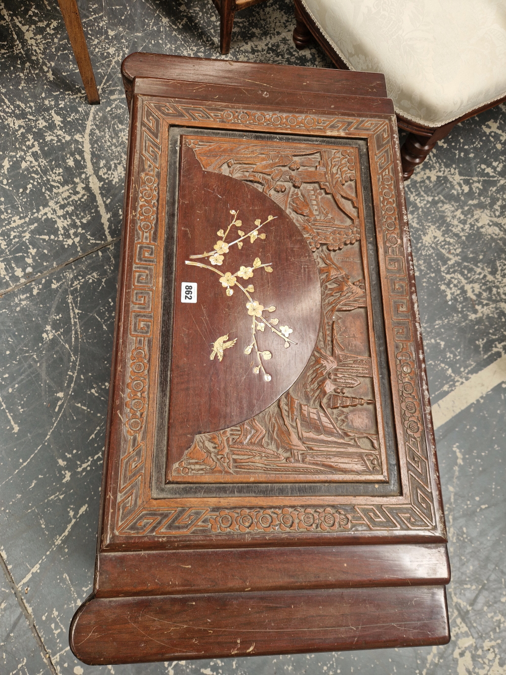 A CHINESE COFFER INLAID WITH MOTHER OF PEARL SPRAYS OF CHERRY BLOSSOM WITHIN RELIEF CARVING OF - Image 2 of 3