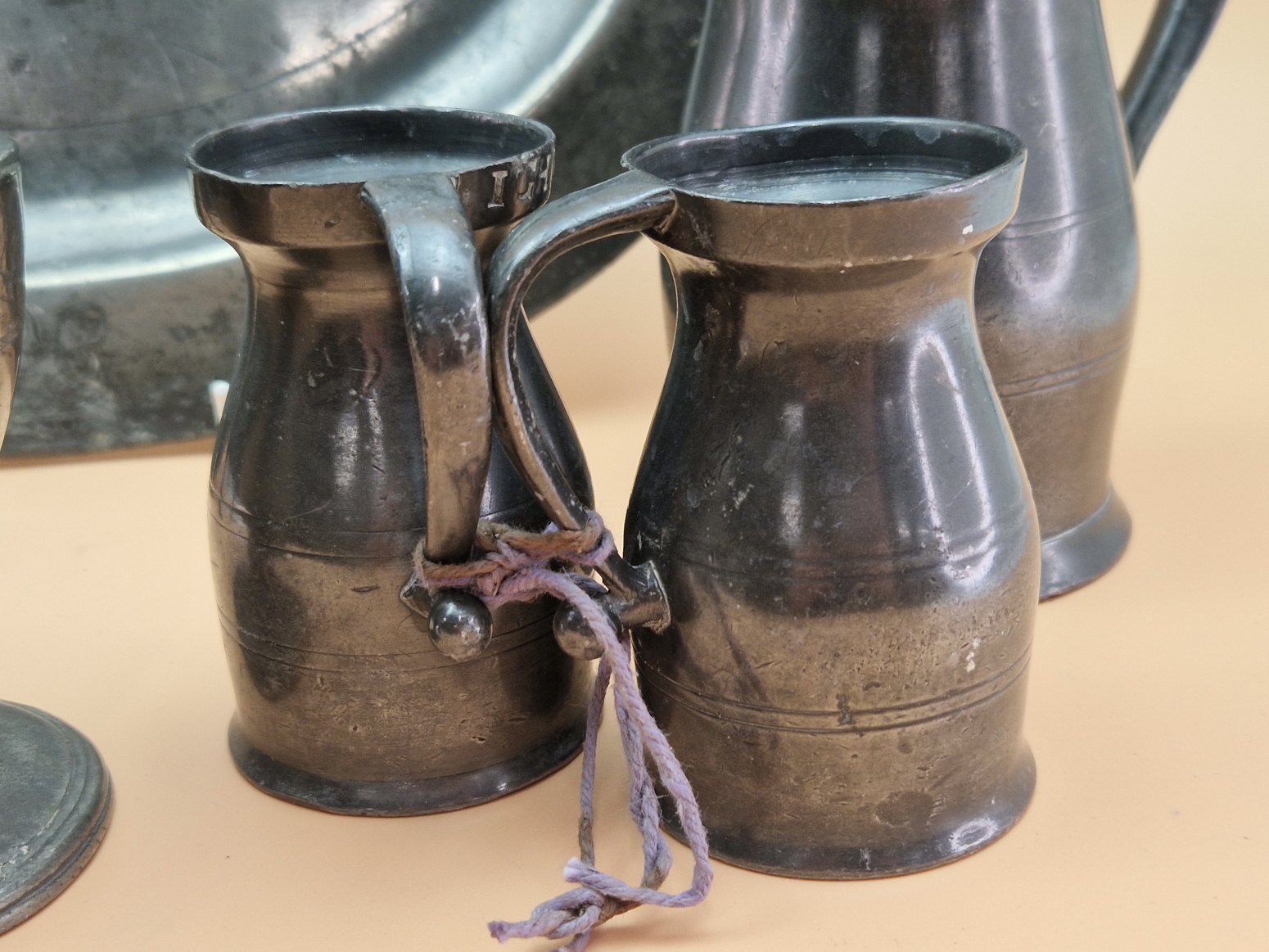 PEWTER: TWO OVAL DISHES, A BRAZIER, A CASTER, TWO SPIRIT MEASURES, A LIDDED PINT MUG AND A HALF PINT - Image 2 of 8