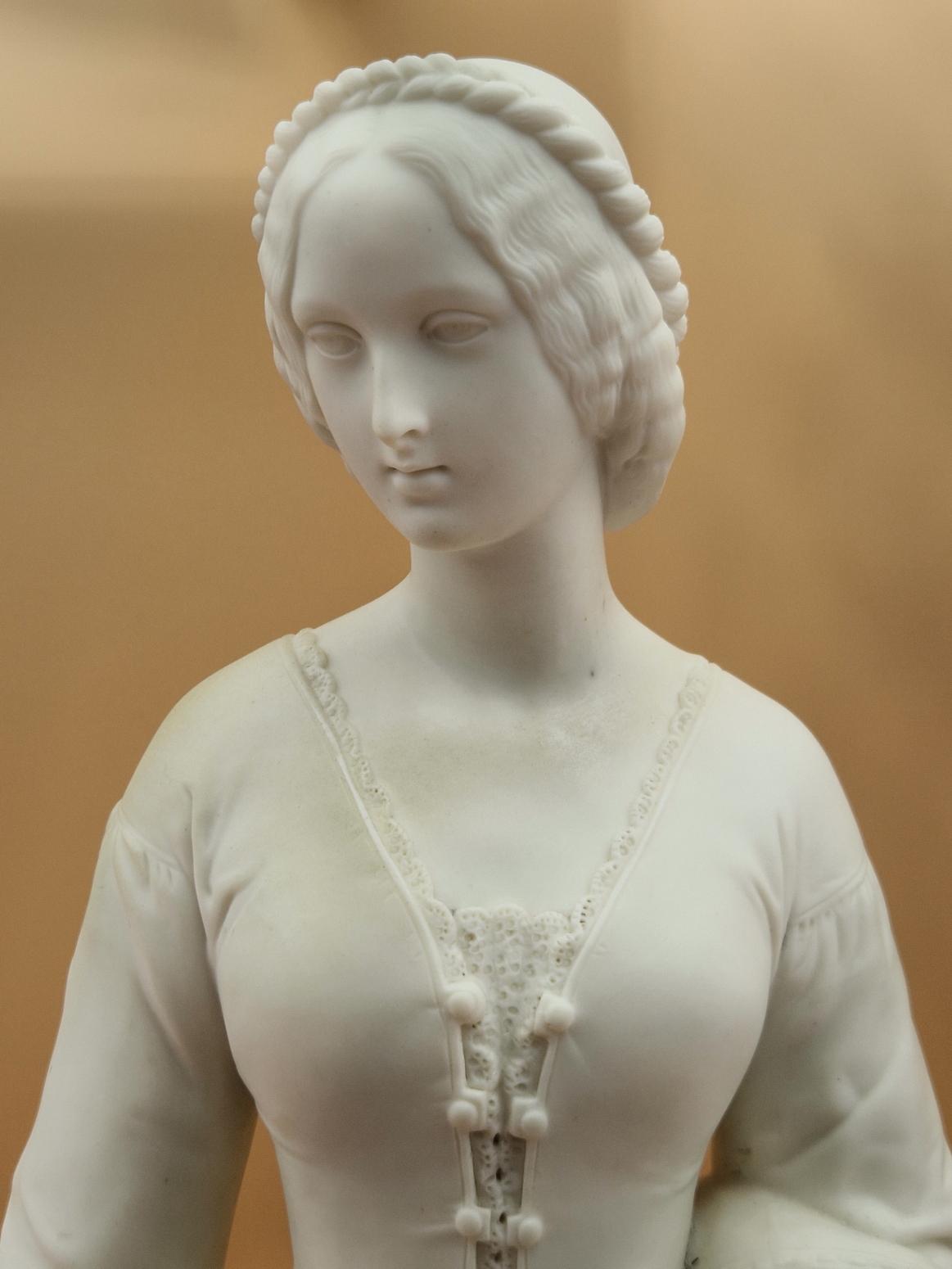 A MINTON PARIAN FIGURE OF A VICTORIAN LADY STANDING ON A CIRCULAR CARPET MOULDED BASE HOLDING UP A - Image 5 of 10