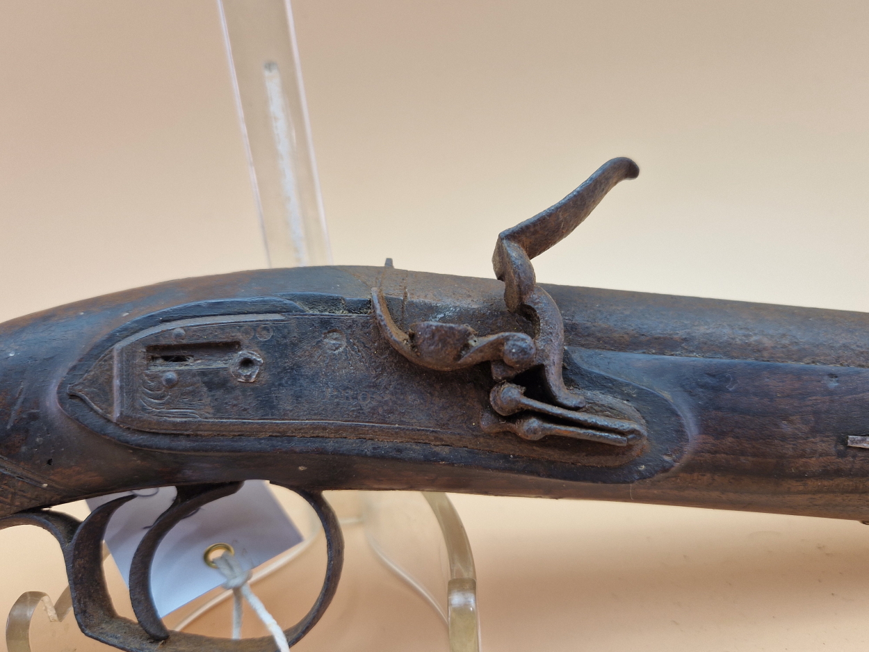 A PROSSER FLINTLOCK PISTOL AND RAMROD, THE FISHTAIL CARVED GRIP ABOVE AN IRON BUTT - Image 2 of 4