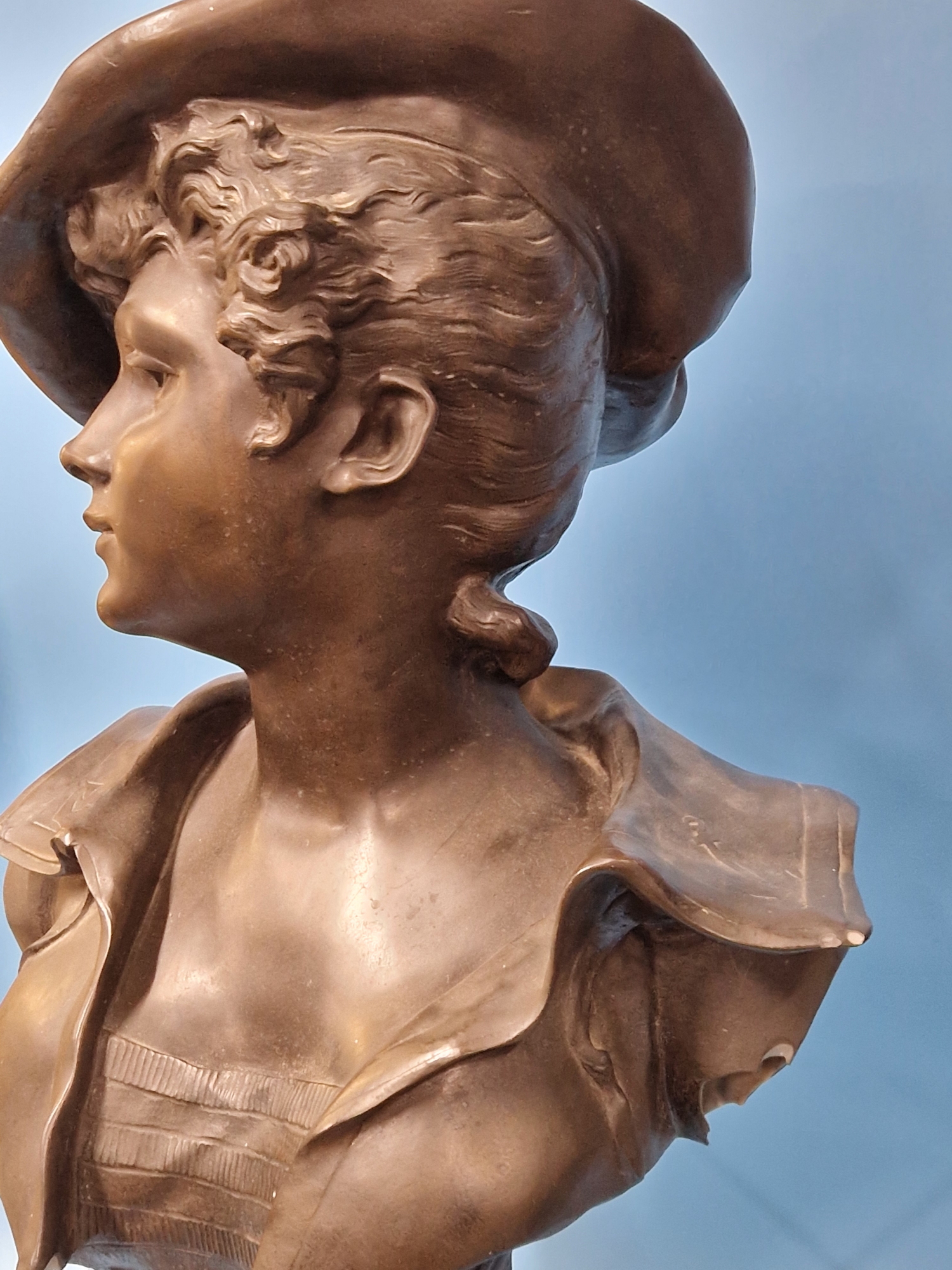 A BRONZED COMPOSITION BUST LABELLED LA CANOTIERE PAR DUTRION, SHE WEARS A CAP AND HAS ANCHORS ON THE - Image 9 of 10