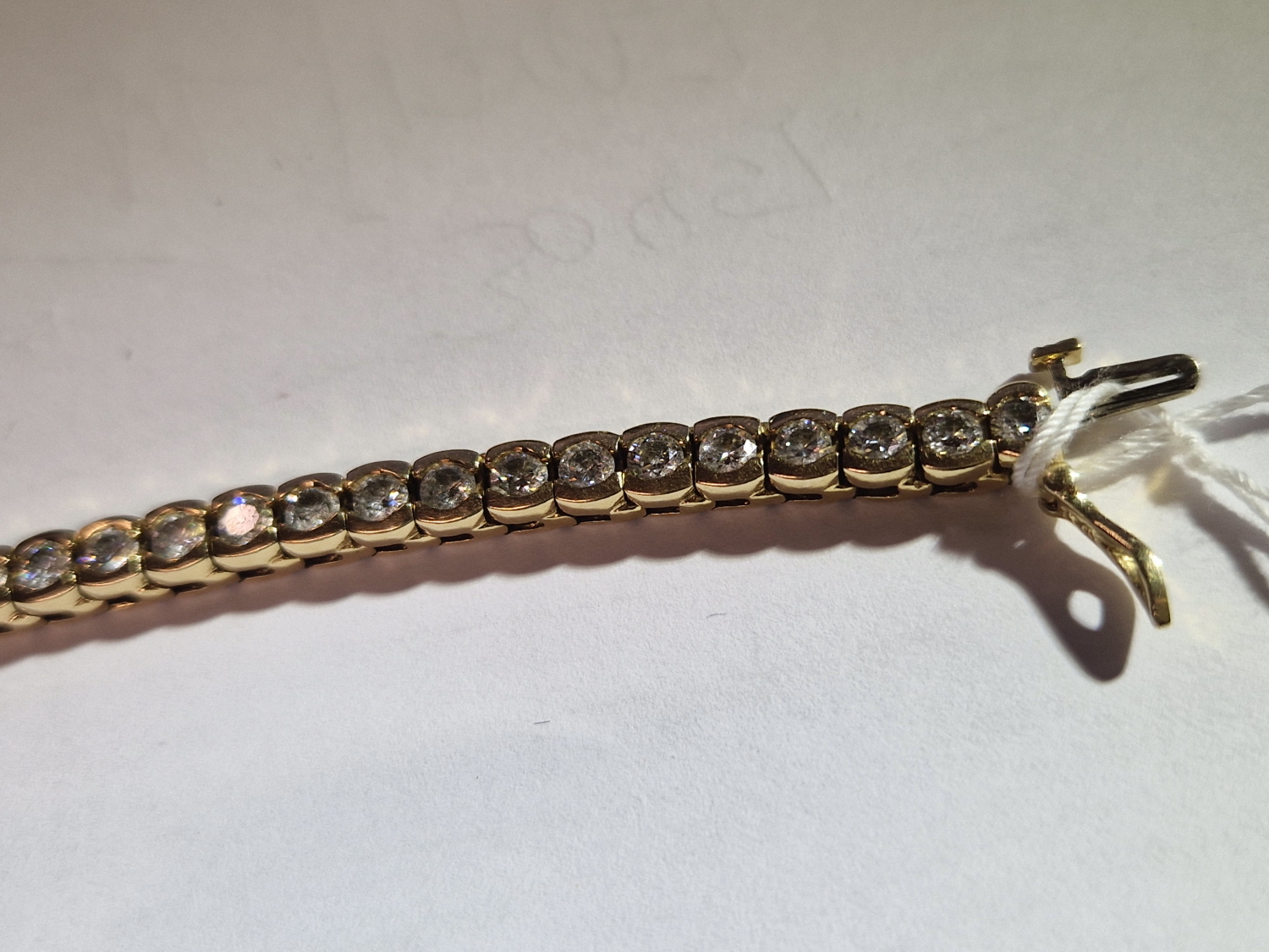A DIAMOND LINE BRACELET. THE BRACELET WITH FORTY-SIX SLIGHTLY GRADUATED ROUND BRILLIANT CUT DIAMONDS - Image 8 of 15
