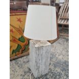 A RUSTIC STYLE WHITE PAINTED TABLE LAMP WITH SHADE.