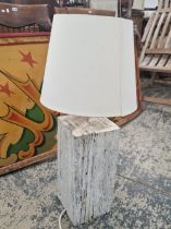 A RUSTIC STYLE WHITE PAINTED TABLE LAMP WITH SHADE.