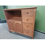 AN ARTS AND CRAFTS STYLE OAK SIDE CABINET IN THE MANNER OF HEALS.