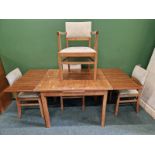 AN ART DECO WALNUT DINING SUITE, TABLE SIX CHAIRS, AND SIDEBOARD.