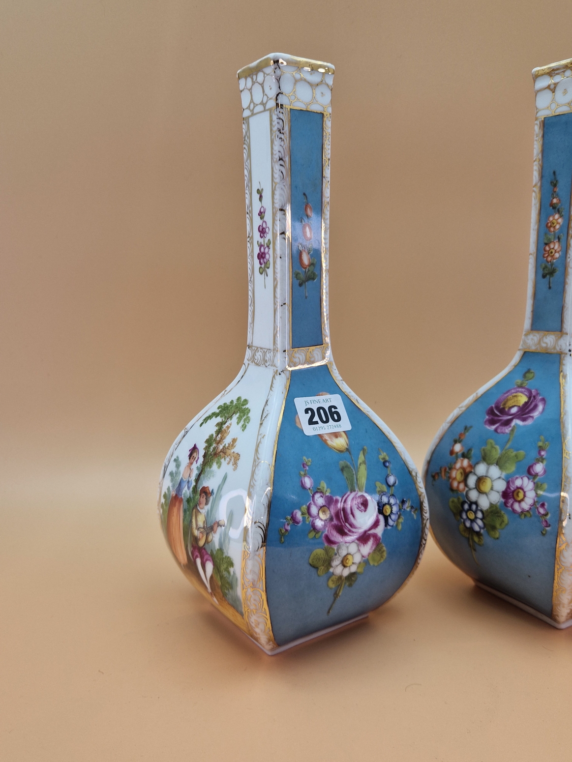 A PAIR OF CROWN DRESDEN SQUARE SECTIONED BOTTLE VASES PAINTED WITH BLUE GROUND FLORAL PANELS - Image 2 of 5