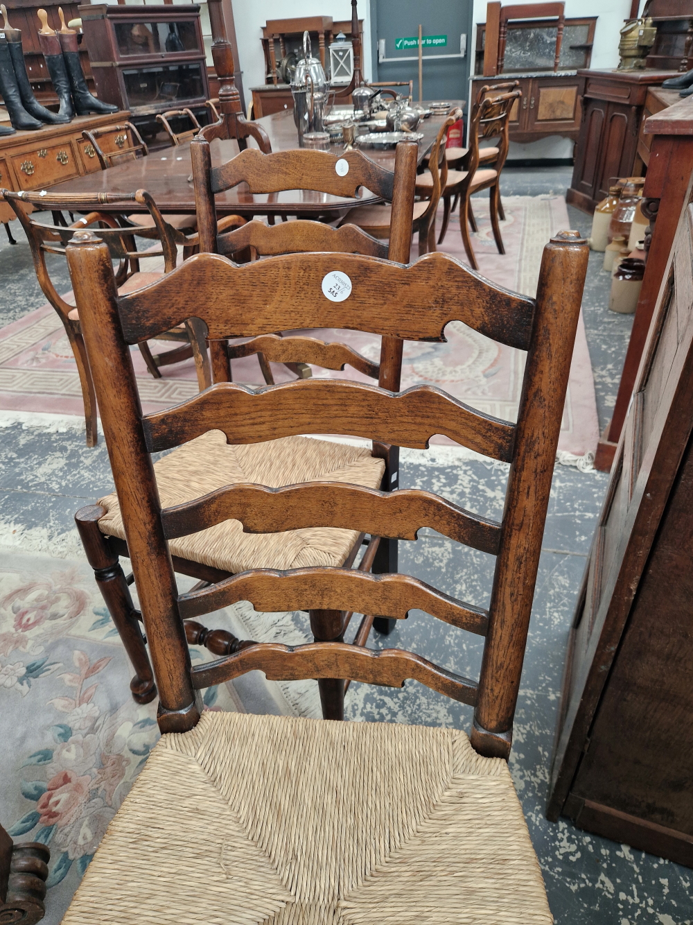 A SET OF SIX OAK LADDER BACK CHAIRS WITH RUSH DROP IN SEATS - Image 4 of 4