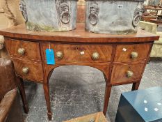 A 19TH CENTURY BOW FRONT SIDEBOARD WITH ARRANGEMENT OF DRAWERS STANDING ON SQUARE TAPERED LEGS