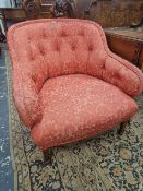 A MAHOGANY ARMCHAIR, THE ROUNDED BACK BUTTON UPHOLSTERED IN TERRACOTTA DAMASK