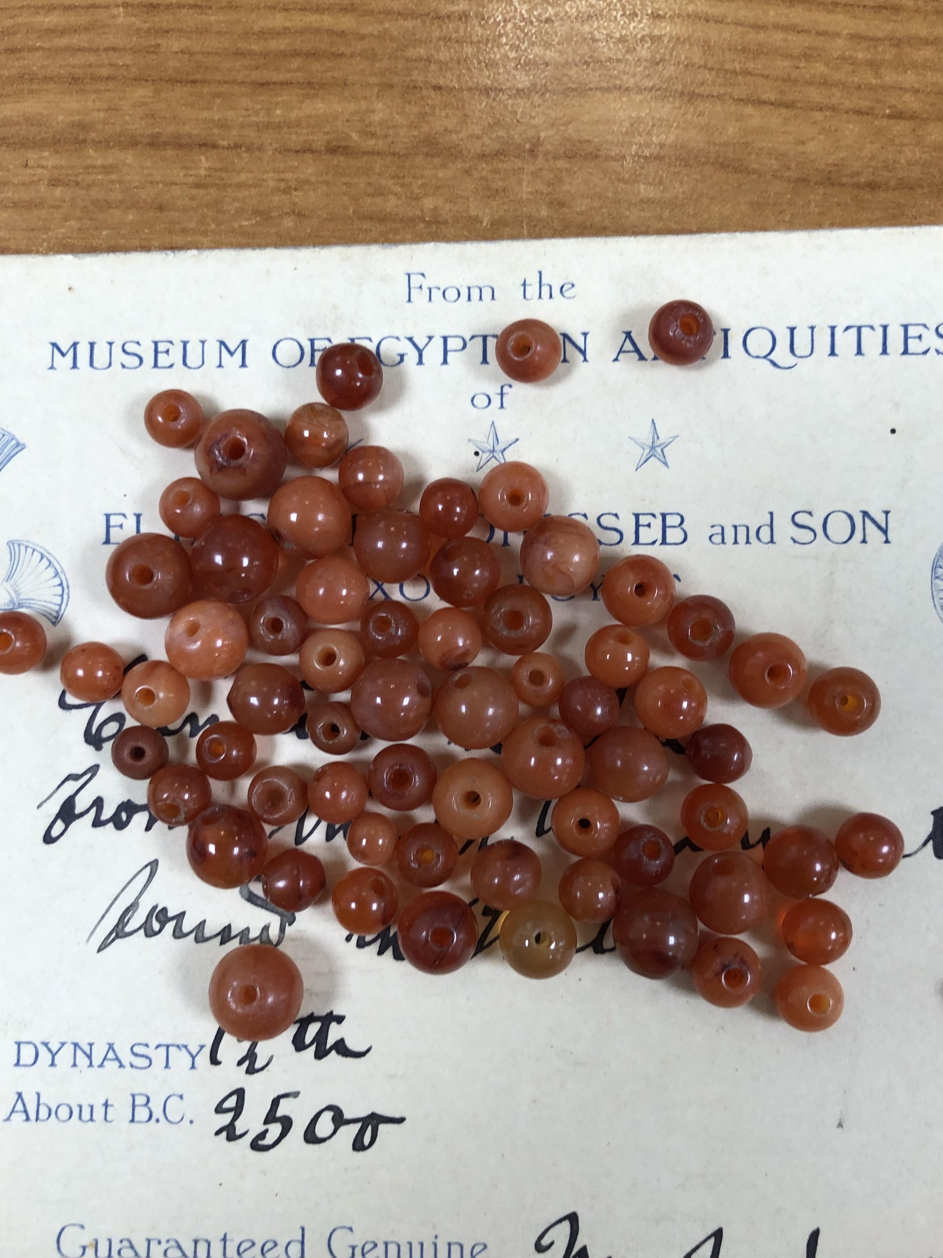 A COLLECTION OF EGYPTIAN CORNELIAN SPHERICAL BEADS - Image 6 of 7