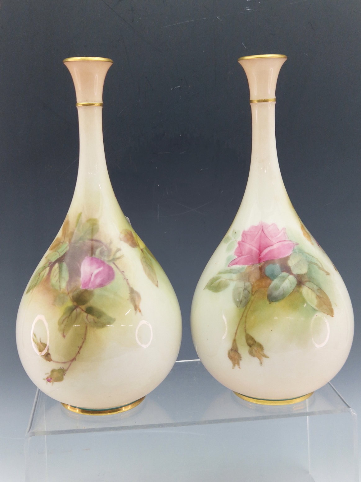 A PAIR OF EARLY 20th C. ROYAL WORCESTER BOTTLE VASES PAINTED WITH RED ROSES. H 21.5cms. - Image 3 of 5