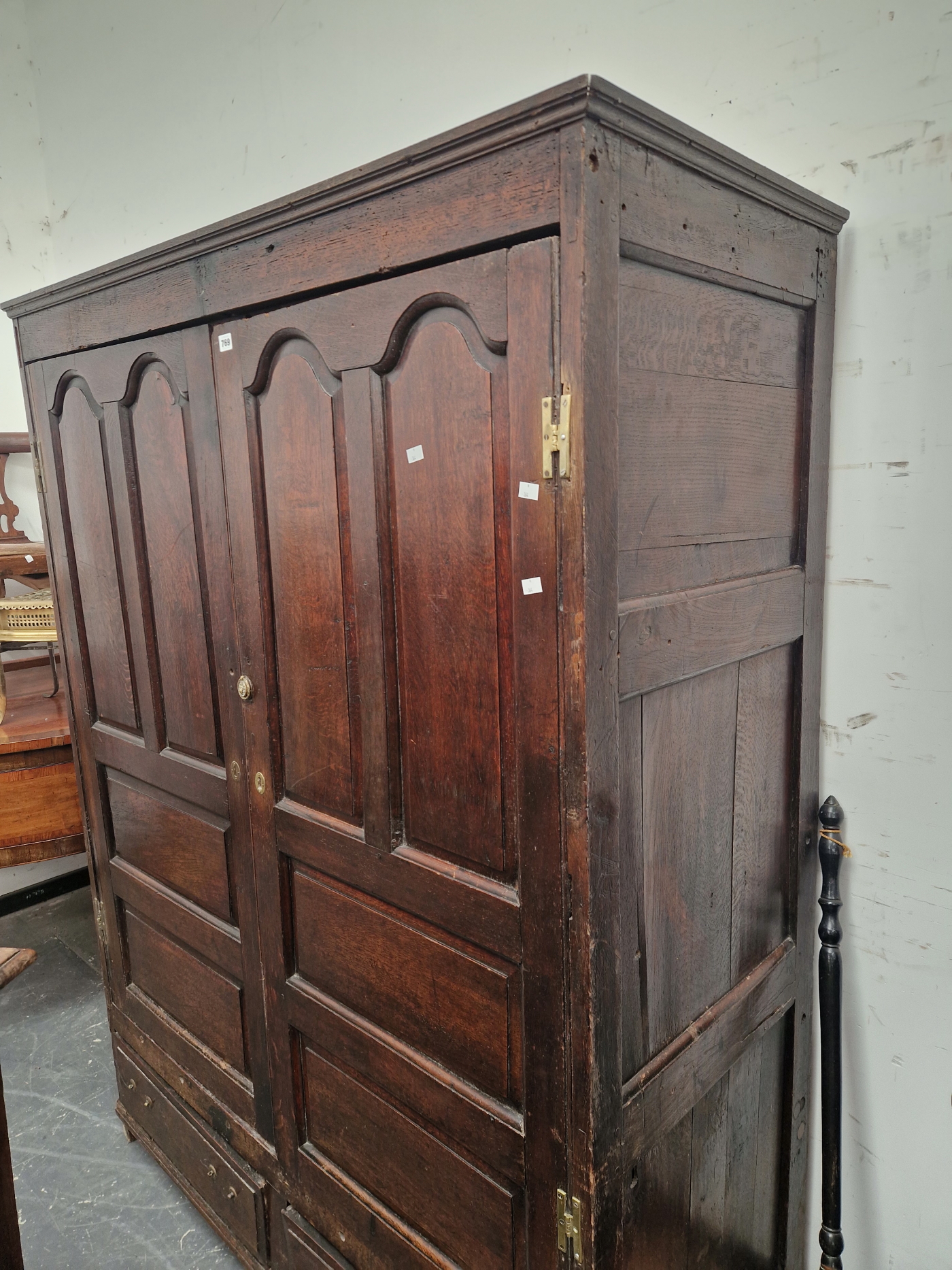 A 18th C. OAK CUPBOARD WITH PANELLED DOORS ENCLOSING HANGING SPACE OVER TWO SHORT DRAWERS. W 141 x D - Image 4 of 5