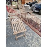 TWO GOOD QUALITY BRASS MOUNTED TEAK STEAMER CHAIRS WISH ASSOCIATED CUSHIONS