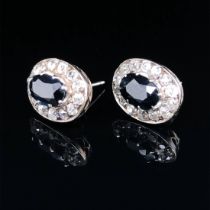 A PAIR OF EARLY 20th CENTURY SAPPHIRE AND DIAMOND CLUSTER STUD EARRINGS. ESTIMATED APPROX. TOTAL