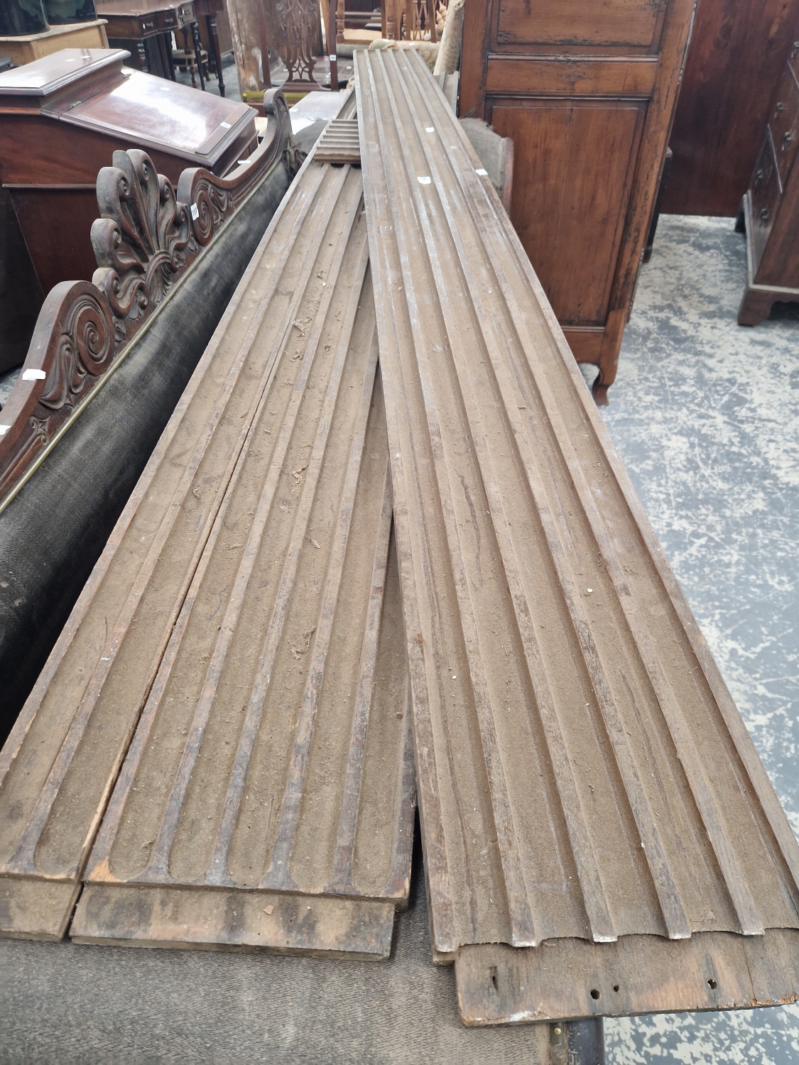 A PAIR OF OAK FLUTED PANELS OR PILASTERS. W 256cms.