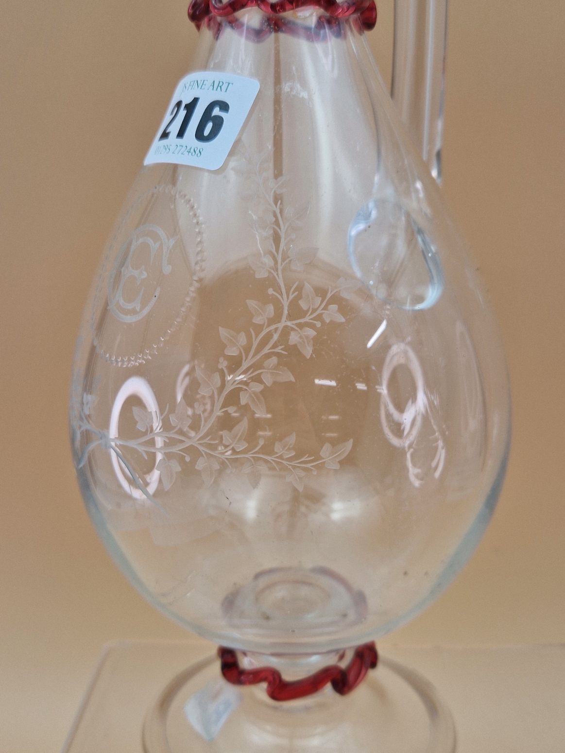 TWO LATE VICTORIAN BALUSTER GLASS EWERS, BOTHER WITH HOLLOW HANDLES, ONE ENGRAVED WITH TRAILING - Image 3 of 8