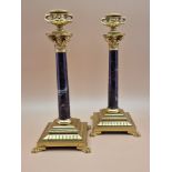 A PAIR OF RED MARBLE AND ORMOLU CANDLESTICKS, THE TWO HANDLED URN NOZZLES ABOVE CORINTHIAN CAPITALS,