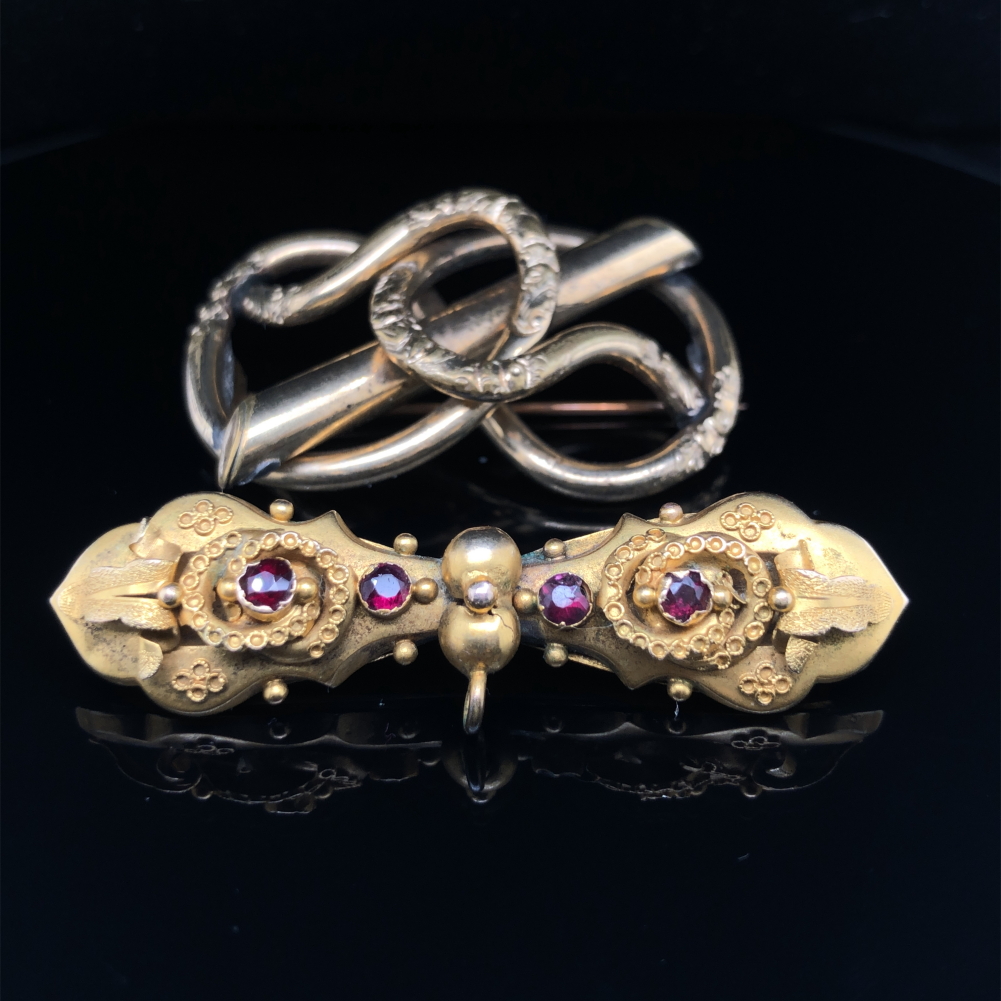 TWO ANTIQUE BROOCHES. THE GEMSET EXAMPLE, THE FRONT ASSESSED VARIOUSLY BETWEEN 12ct -15ct, THE
