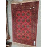 AN AFGHAN BOKHARA RUG 125 x 78 cm.