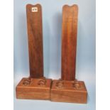 TWO WEIGHTED MAHOGANY CHARGER STANDS, A SERPENTINE COLUMNAR STAND, A PAIR OF PINK MARBLE STANDS