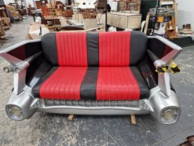 A MID CENTURY STYLE DINER SEAT FORMED AS THE TAIL END OF A CADILLAC