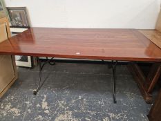A STAINED WOOD CLEATED PLANK TOP RECTANGULAR REFECTORY TABLE ON CURVED IRON LEGS. W 183 x D 102 x