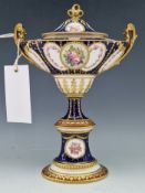 A CROWN DERBY BLUE GROUND TWO HANDLED OVAL URN AND COVER, DATE LETTER FOR 1904, PAINTED WITH GOLD