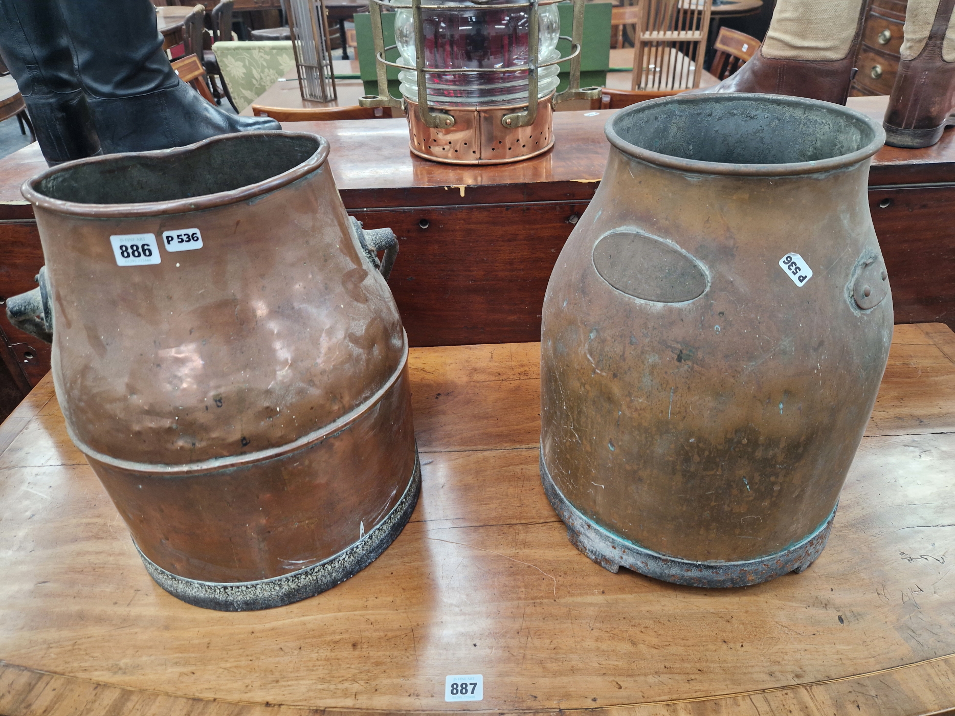 A PAIR OF COPPER CHURNS, ONE WITH IRON SWING OVER HANDLE