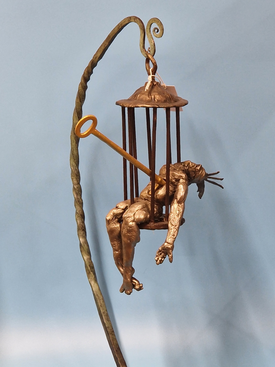 FELIPE GONZALEZ, A CONTEMPORARY BRONZE SCULPTURE OF A MAN IN A CAGE HELD ON A BRACKET ARM RESTING ON - Image 2 of 13