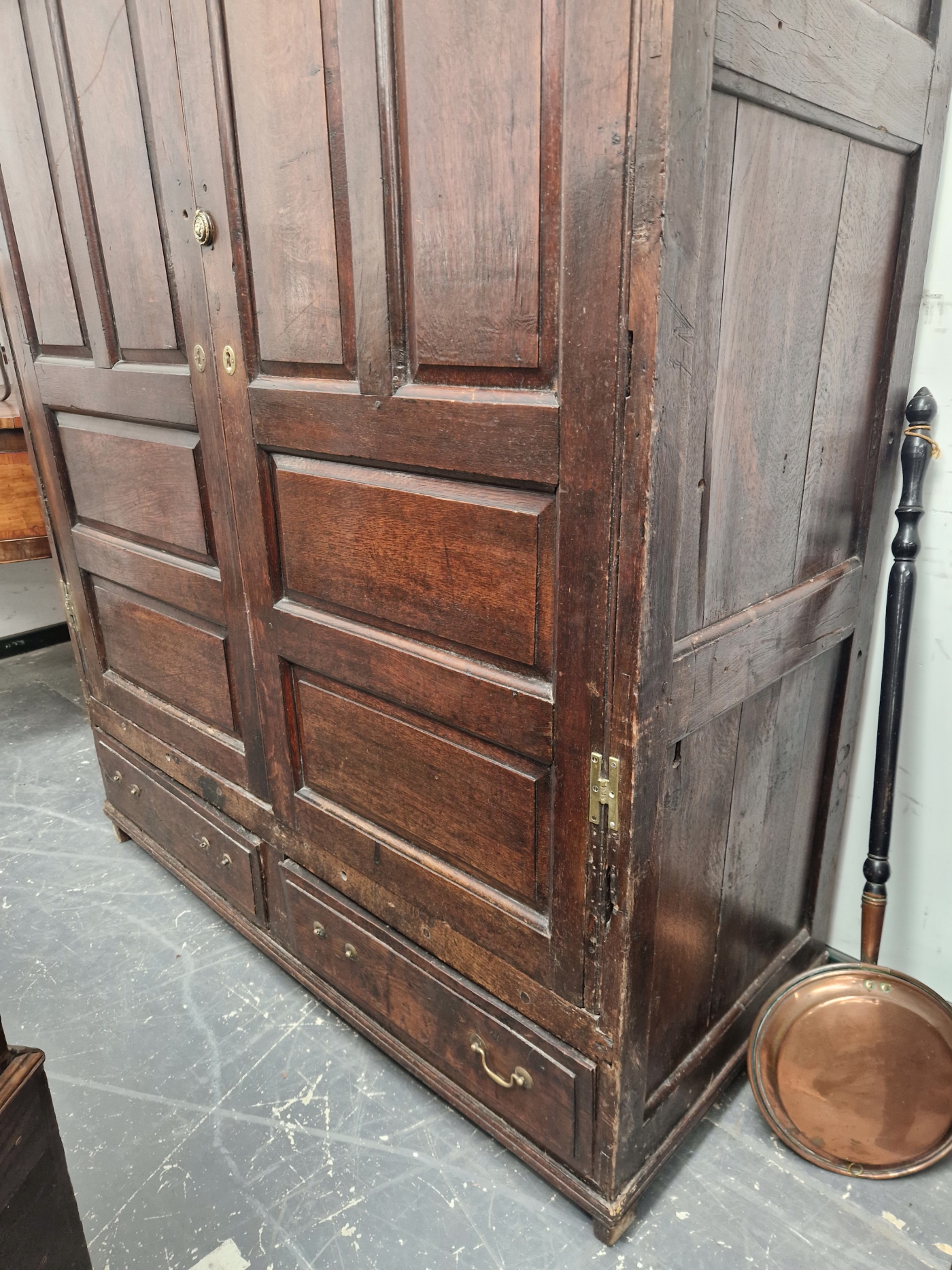 A 18th C. OAK CUPBOARD WITH PANELLED DOORS ENCLOSING HANGING SPACE OVER TWO SHORT DRAWERS. W 141 x D - Image 5 of 5