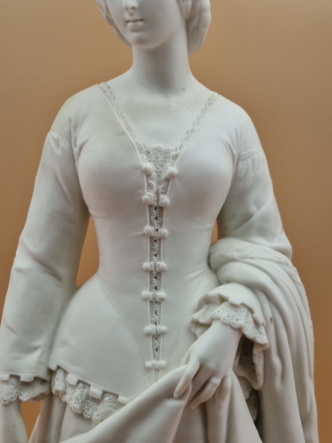 A MINTON PARIAN FIGURE OF A VICTORIAN LADY STANDING ON A CIRCULAR CARPET MOULDED BASE HOLDING UP A - Image 4 of 10