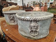 A PAIR OF 19th C. LEAD CYLINDRICAL PLANTERS WITH GADROONED RIMS ABOVE FOUR LION MASK AND RING