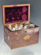 A FLORAL MARQUETRIED MAHOGANY PHARMACY CHEST CONTAINING EIGHT BOTTLES, THE BOX. W 18cms.