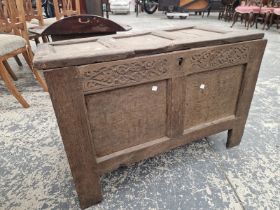 AN 18th C. OAK COFFER WITH A TWO PANELLED FRONT. W 980 x D 45 x H 60cms.