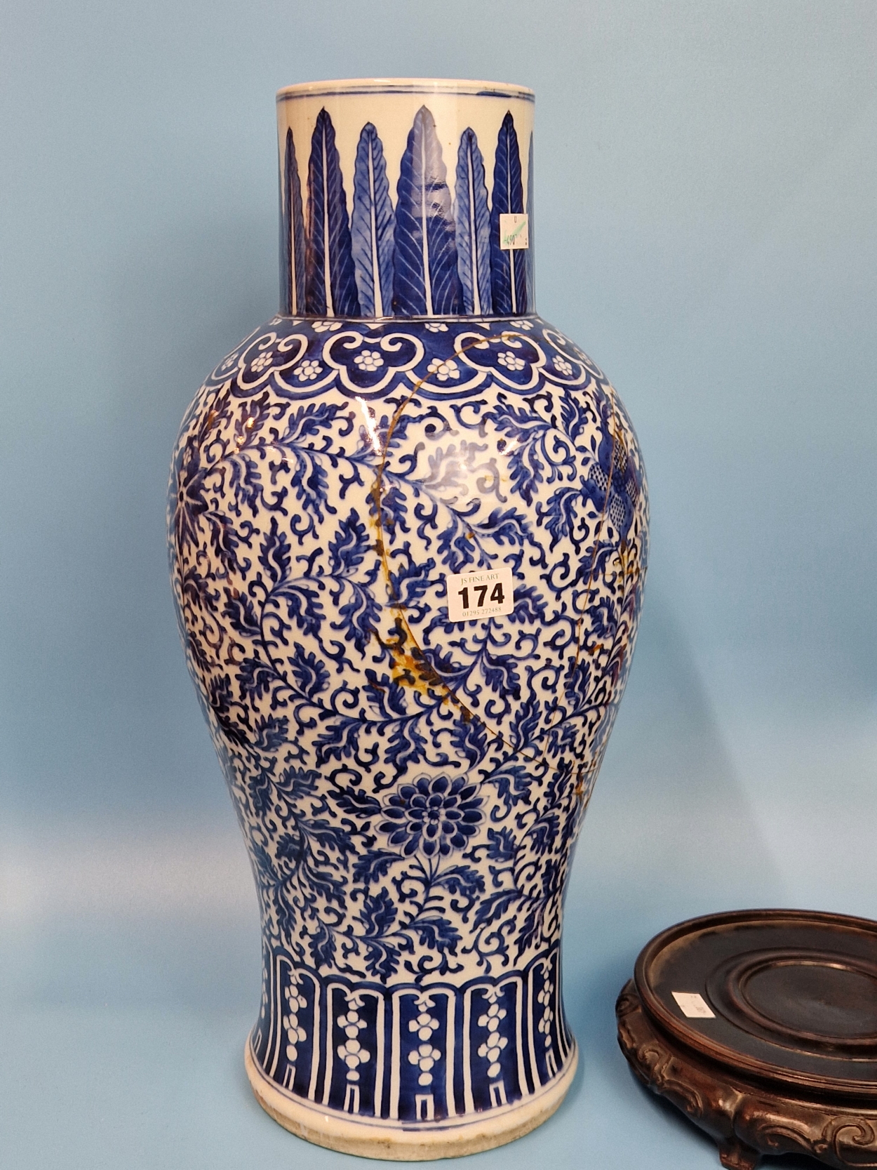 A CHINESE BLUE AND WHITE BALUSTER VASE PAINTED WITH SCROLLING LOTUS BETWEEN STIFF LEAF AND LAPPET