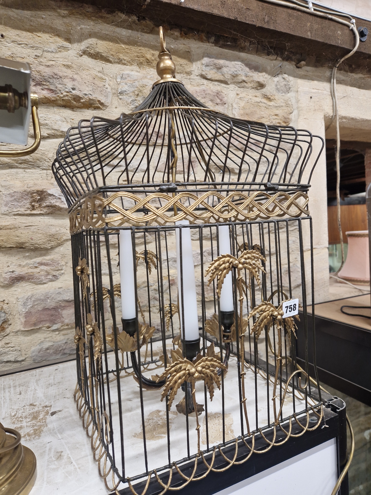 A THREE CANDLE SOCKET CEILING LIGHT WITHIN A PARCEL GILT WIRE WORK BIRD CAGE SHADE. H 65cms.