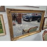 A VICTORIAN STYLE RECTANGULAR FRAMED WALL MIRROR.