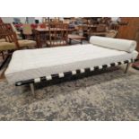 A VINTAGE DAY BED WITH METAL FRAME, CHROME LEGS AND WHITE LEATHER MATTRESS.