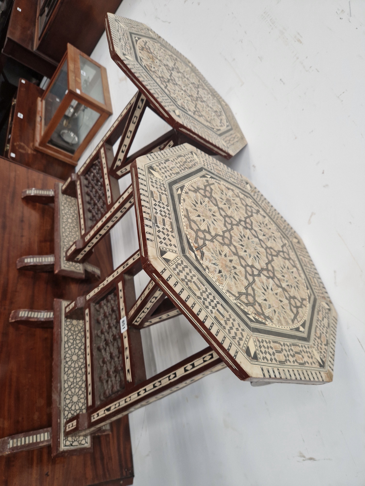 A PAIR OF ISLAMIC FOLDING OCTAGONAL TABLES GEOMETRICALLY INLAID IN MOTHER OF PEARL AND EBONY - Image 2 of 13