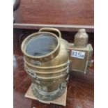 A BRASS MOUNTED SHIPS BINNACLE COMPASS WITH OIL POWERED LIGHT