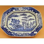 AN 18th C. CHINESE BLUE AND WHITE PLATTER CENTRALLY PAINTED WITH BAMBOO, ROCKS AND A PEONY ON AN