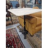 A WHITE MARBLE TOPPED IRON TABLE, THE SQUARE TOP ON A COLUMN WITH TRIPARTITE FOOT. W 61 x D 61 x H