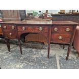 A 19th C. MAHOGANY SIDEBOARD, THE CENTRAL BREAKFRONT DRAWER FLANKED BY A DRAWER OVER A DOOR AND BY A