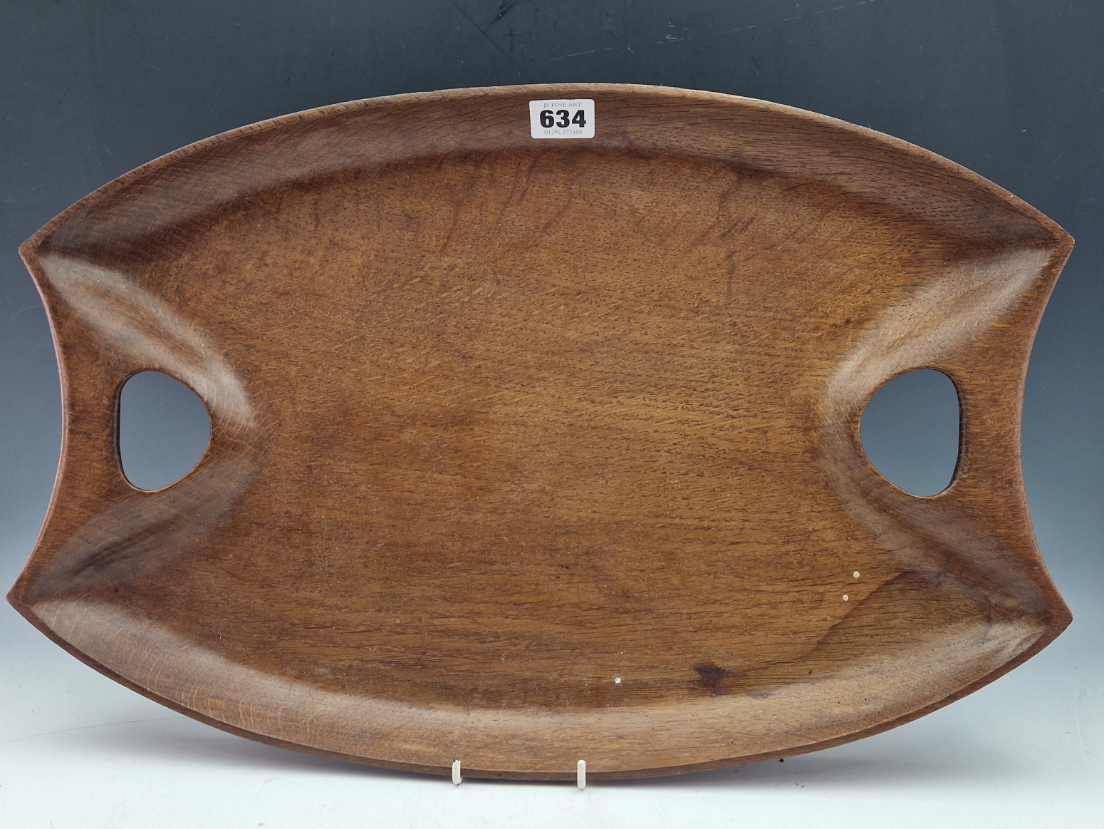 AN ARTS AND CRAFTS OAK TWO HANDLED TRAY INDISTINCTLY SIGNED BY A CRAFTSMAN FROM RYE