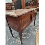 AN EDWARDIAN RED MARBLE TOPPED MAHOGANY WASH STAND WITH TWO SATIN WOOD BANDED DOORS ABOVE THE SQUARE