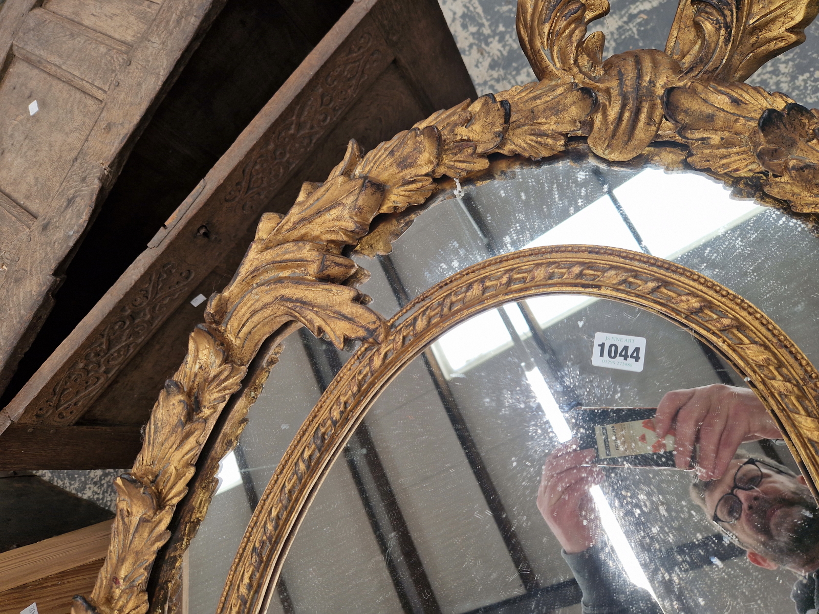 AN OVAL MIRROR WITHIN A FOLIATE GILT FRAME. 130 x 71cms. - Image 3 of 5